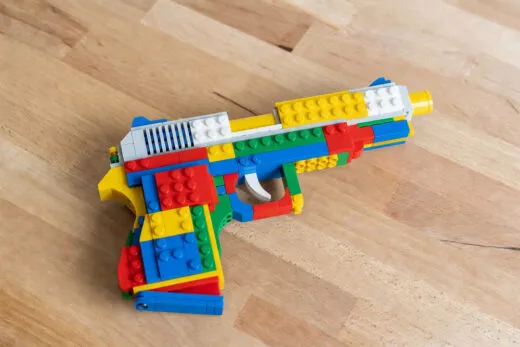LEGO handgun toy image generated by Grok Imagine, an AI model from xAI.