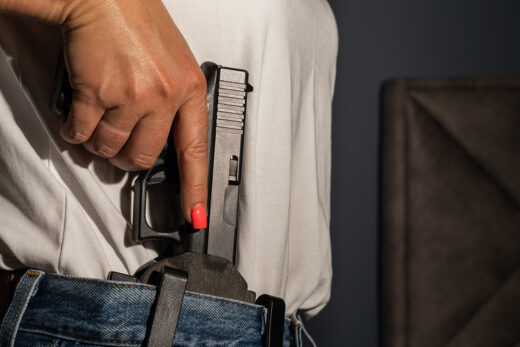Armed woman protects her husband during a home-defense encounter iStock.com/[Dmitri Toms]