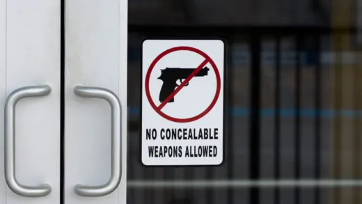 Hawaii Firearms Coalition urges Hawaii businesses to reconsider posting "No Firearms Allowed" signs after the Supreme Court's Wolford decision. iStock-1453704487