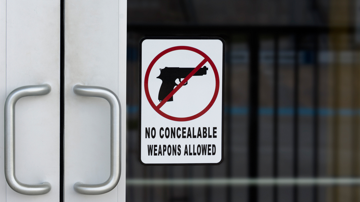 Hawaii Firearms Coalition urges Hawaii businesses to reconsider posting "No Firearms Allowed" signs after the Supreme Court's Wolford decision. iStock-1453704487